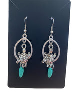 Oval charm earrings made by Alicia Ballard
