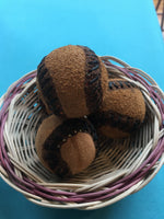 Game balls by Mvskoke artist Eddie Screechowl